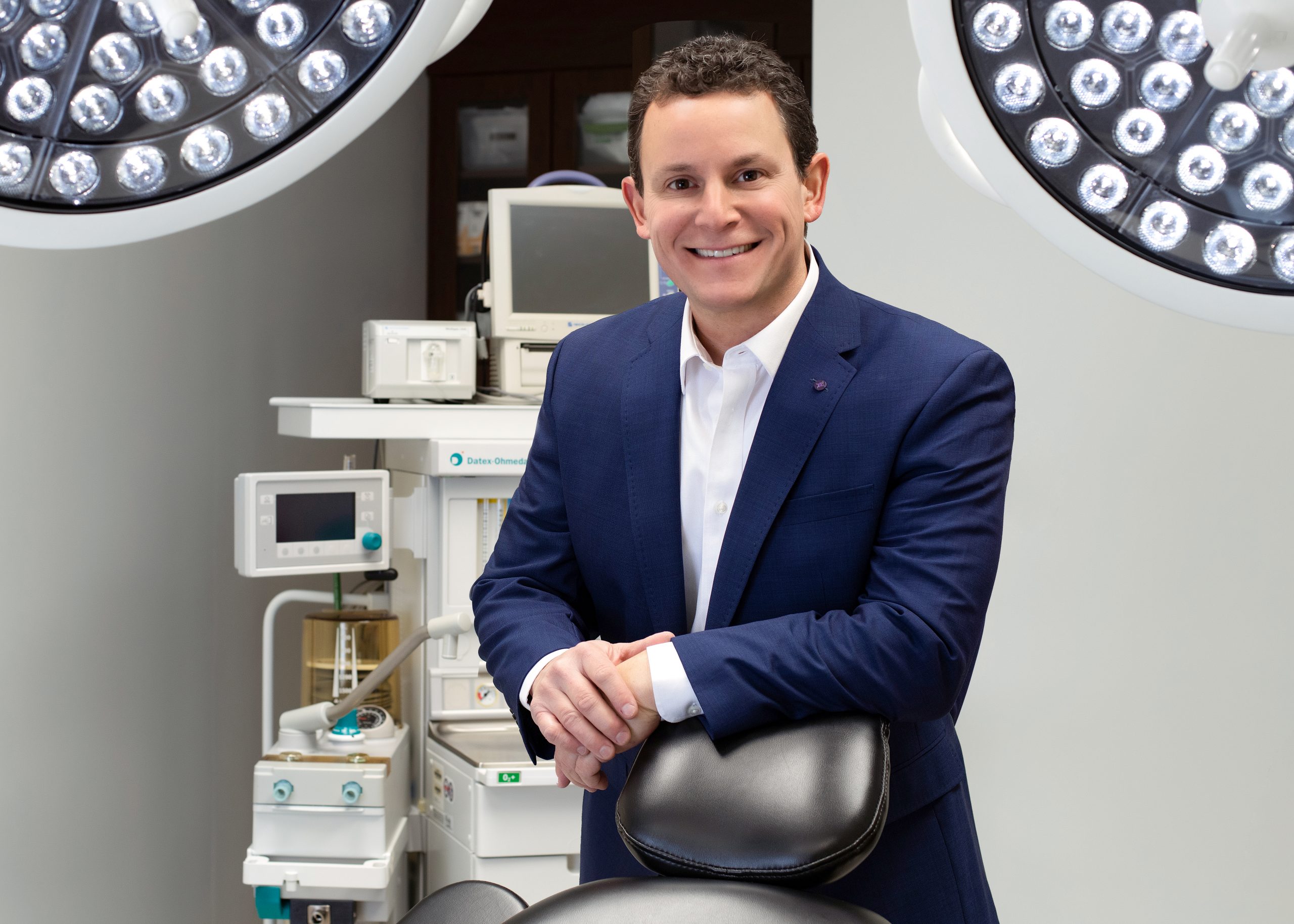 Dr. Steven Constantine of Salt Lake City, Utah standing in the OR with the MTI Patient Chair